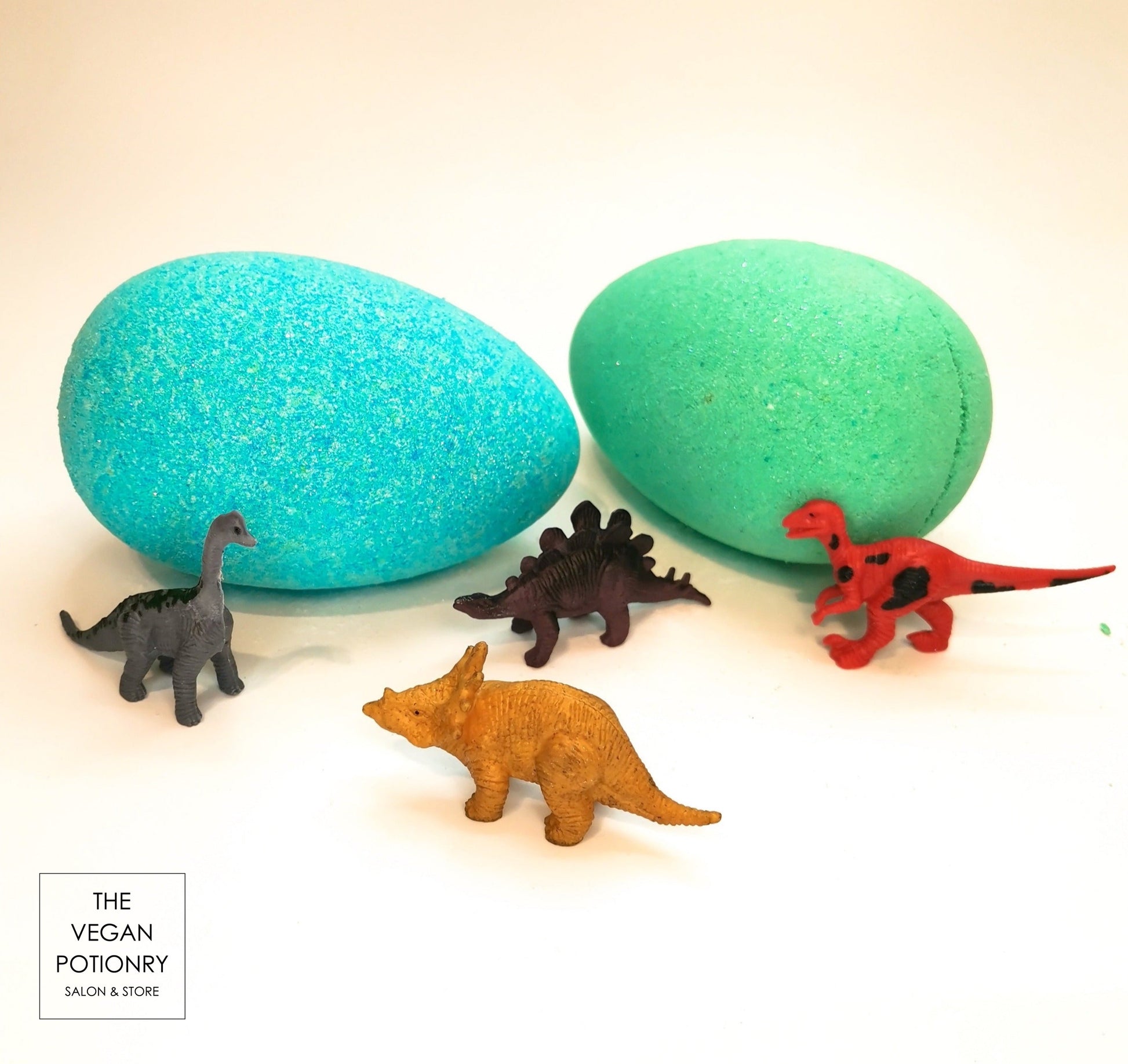 Dino egg bath bombs with dinosaur toys inside