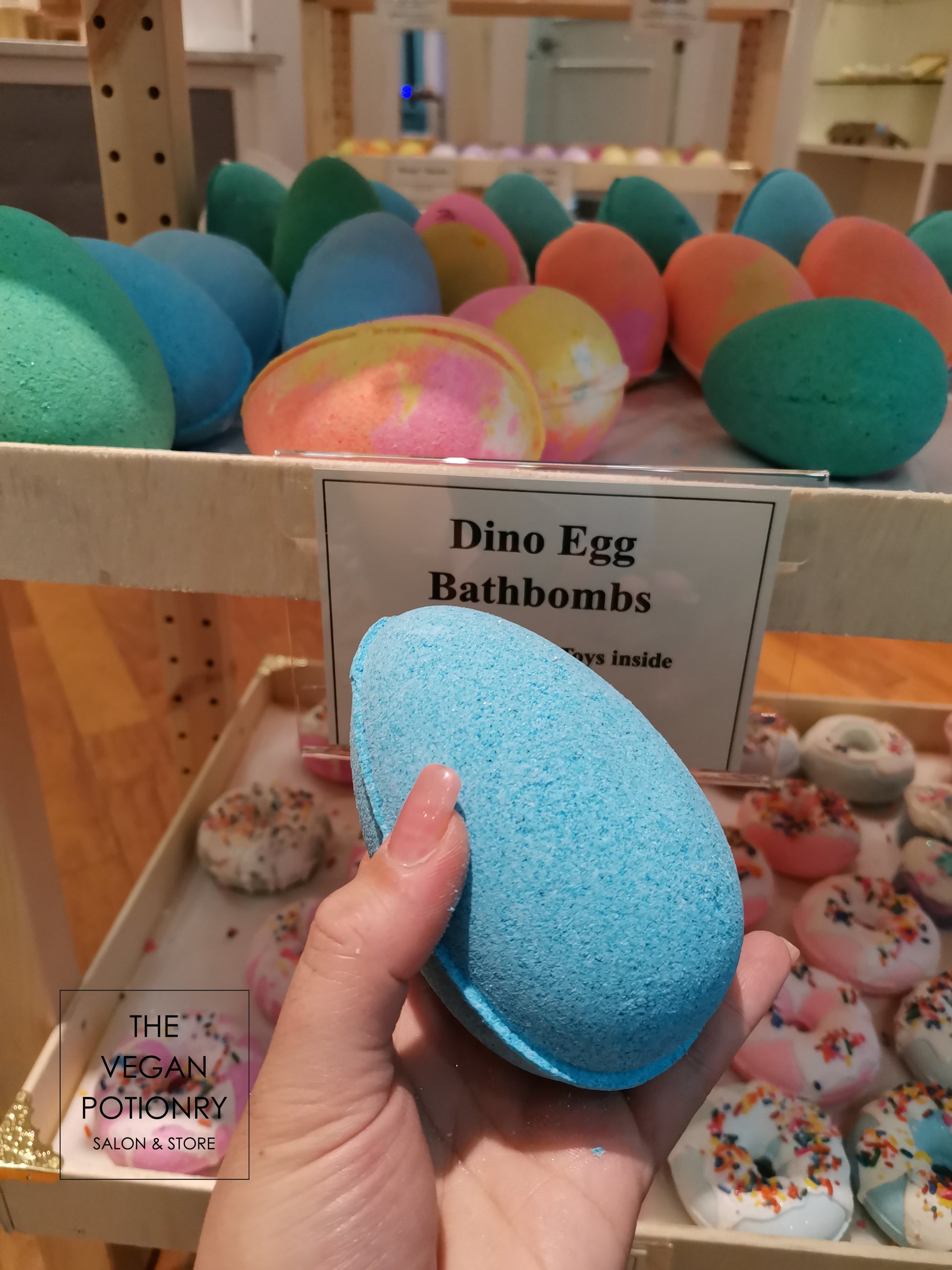 Blue Dino egg bath bombs with dinosaur toys inside